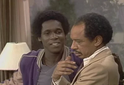 Two men sitting on the couch.