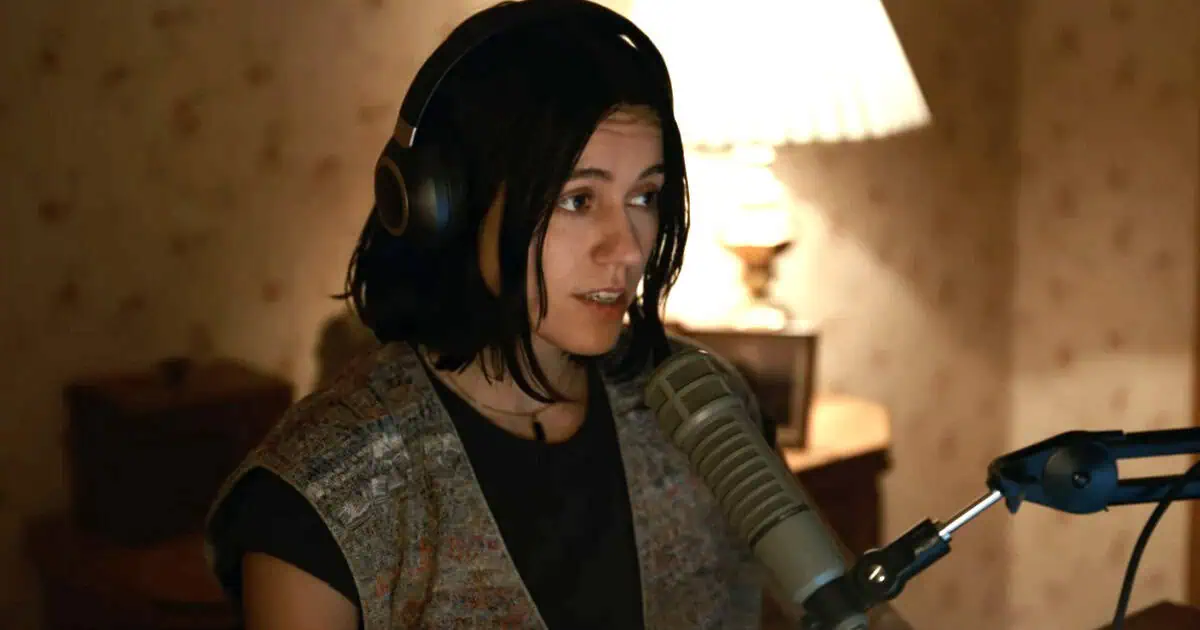 A woman talking into a microphone.