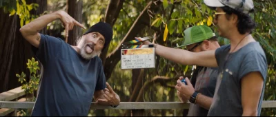 Three guys on the set of Andre Is an Idiot.