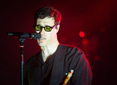 Tom Howie of Bob Moses singing at the mic