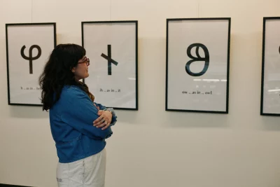 Theadora Soter looking at the deseret alphabet