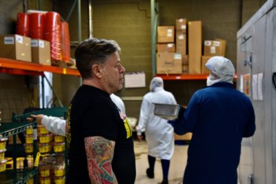Jorge Fierro among the employees of Rico Brand