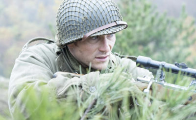 A scene from Lucky Strike. A soldier moves through the brush with a gun in hand. 