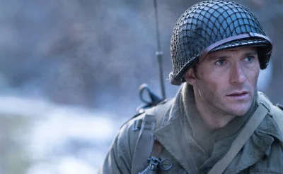 A soldier looking off in the distance.