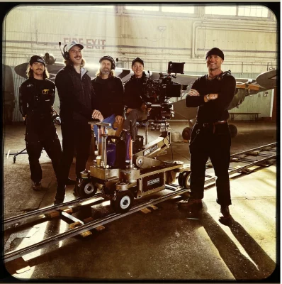 The cinematography crew of Pressure stands together on set.