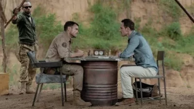 Two guys playing a very dangerous game of chess.
