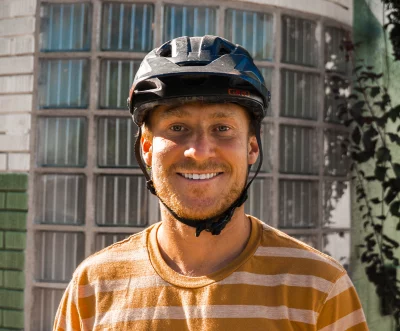 Lucas from Unplugged Wellness smiling in a helmet