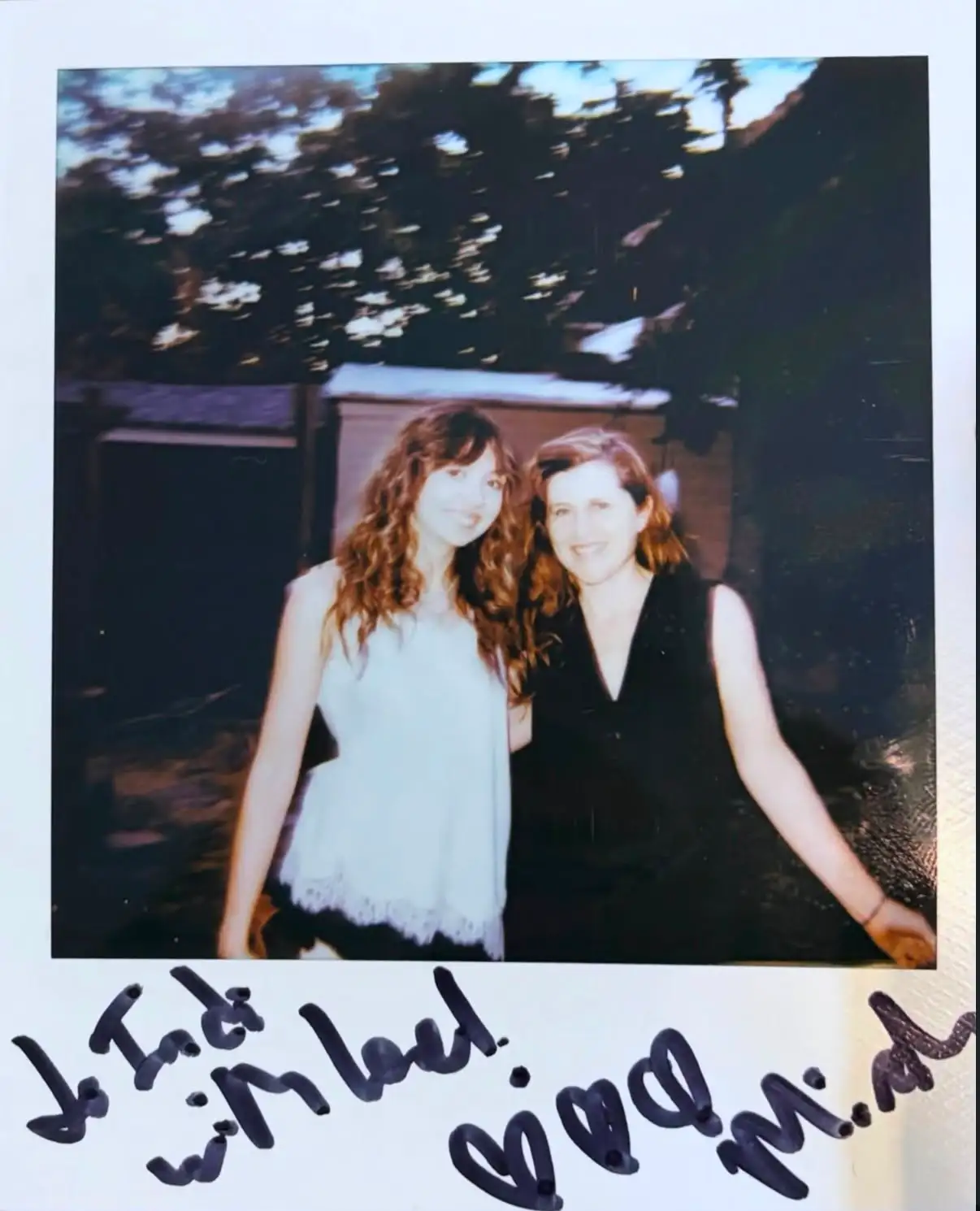A polaroid of the writer and Mirah