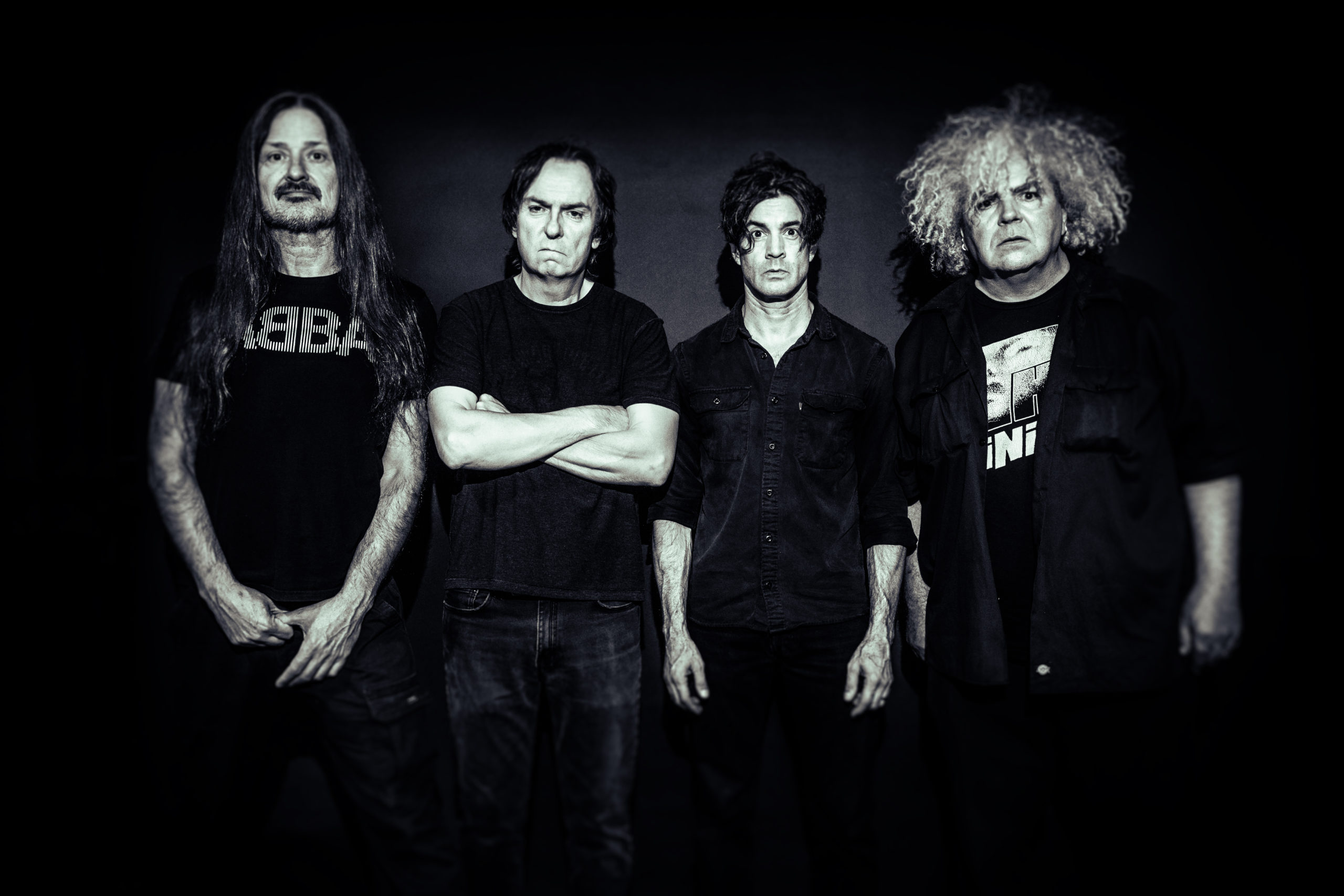 The Melvins band stand side-by-side.