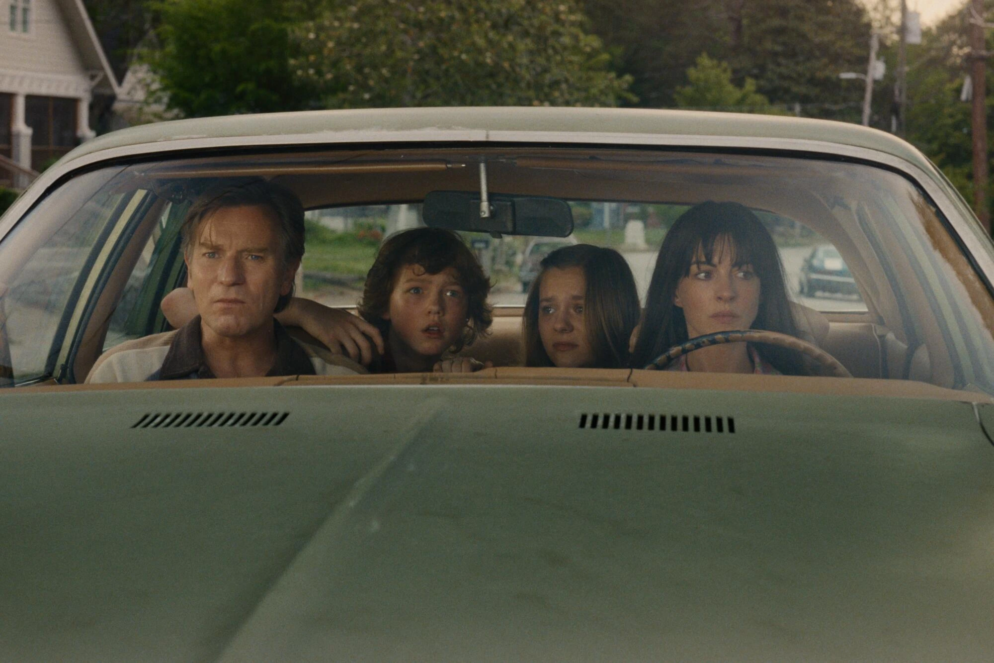 A family of four in a car.