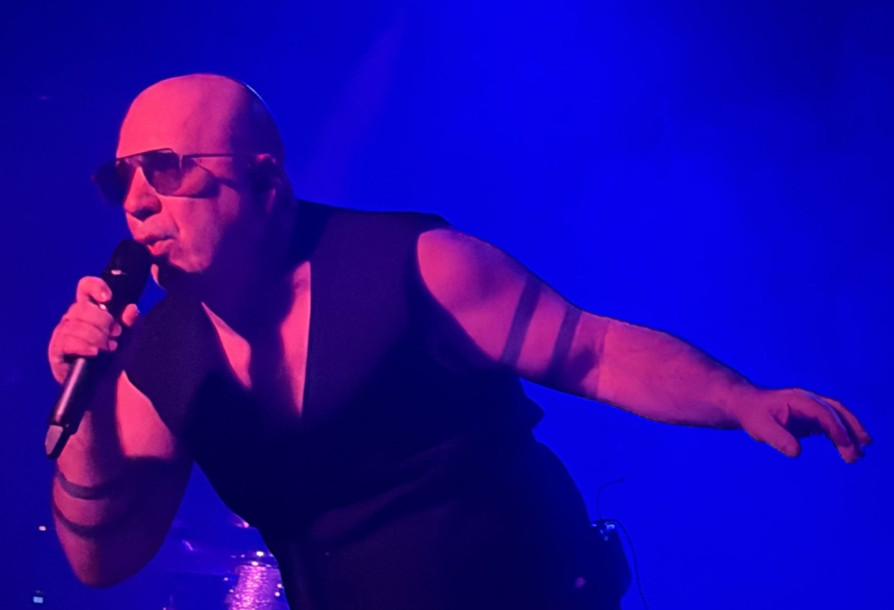 Bon Harris of Nitzer Ebb singing in blue light