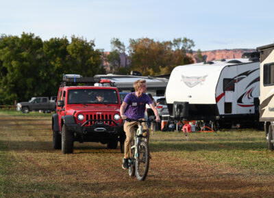 Campground Volunteer leading the way for attendees to their camp spot. Photo: Natalie Simpson