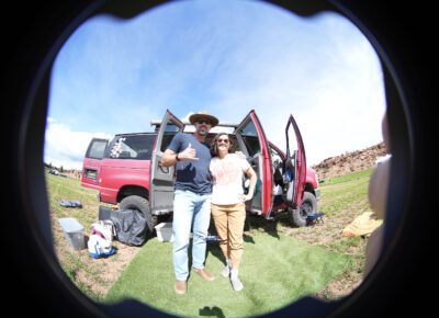 A happy couple in the campground, all set up. Photo: Jake Bleggi