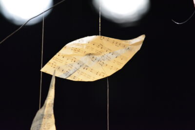 The hanging sheet-music leaves of Facing East's set
